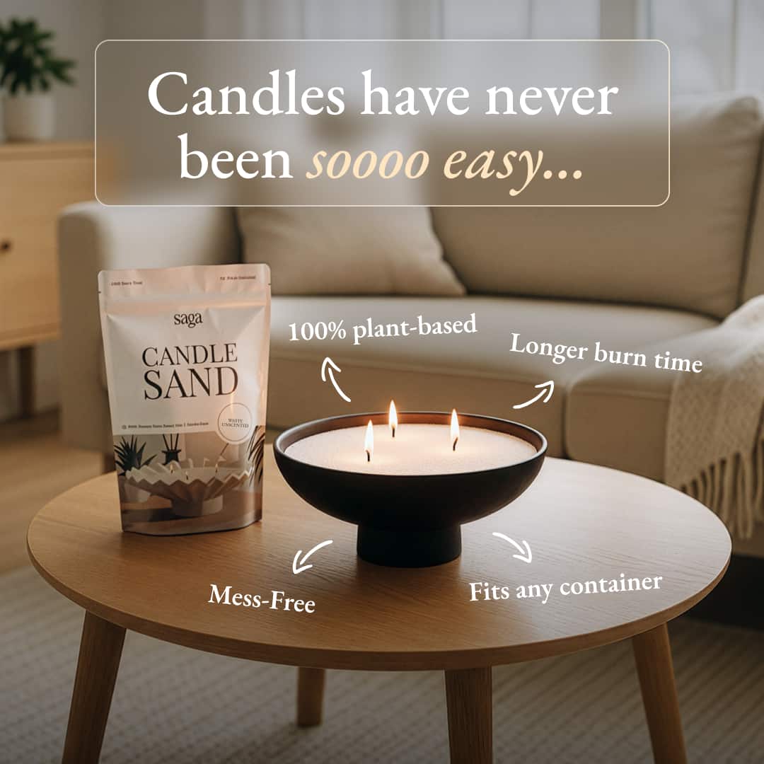 Saga Candle Sand packaging with a candle on a table in a living room setting